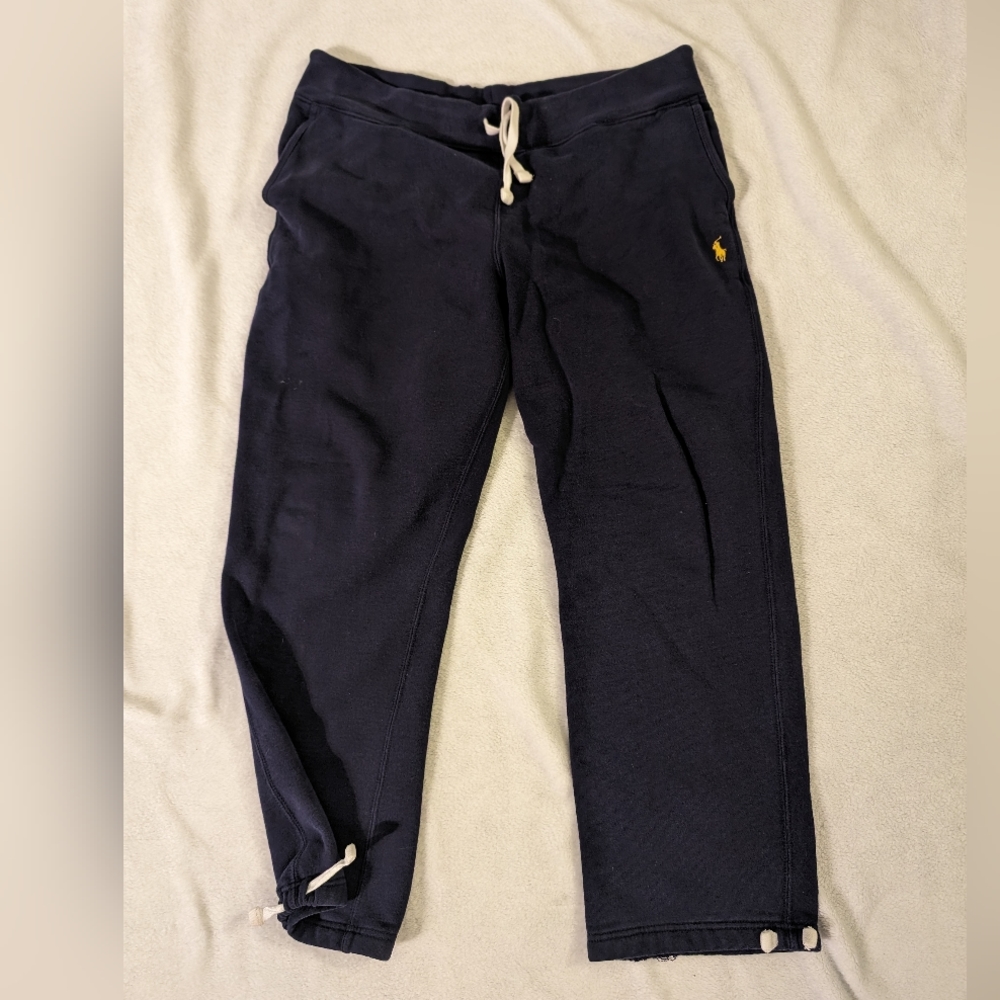 Polo sweat pants with drawstring leg opening.